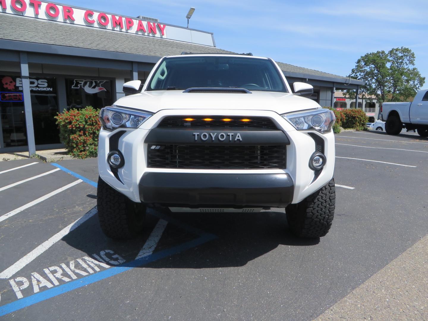 2019 White /black Toyota 4Runner TRD PRO 4WD (JTEBU5JR9K5) with an 4.0L V6 DOHC 24V engine, 5A transmission, located at 2630 Grass Valley Highway, Auburn, CA, 95603, (530) 508-5100, 38.937893, -121.095482 - TRD PRO 4Runner sitting on 17" SCS wheels, BFG KO2 tires, Tyger running boards, Roof Rack with ladder, and window tint. - Photo#1